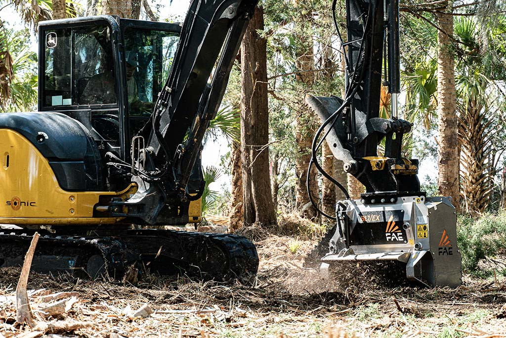 Cat 303.5 mini excavator with disc mulcher attachment at work